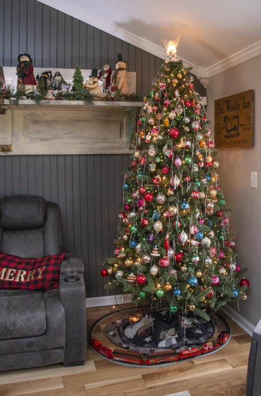 The family room Christmas tree is decorated with vintage balls and tinsel at Geri Ludlam and Connie Heindel’s Hudson Road home.